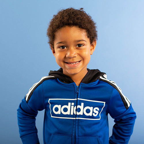 Smiling boy with adidas jacket 